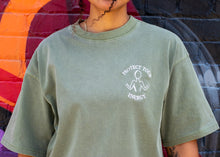 Load image into Gallery viewer, CLOSE UP OF PROTECT YOUR ENERGY LOGO IN THE SAGE GREEN OVERSIZED SHIRT