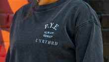 Load image into Gallery viewer, Close up of embroidered P.Y.E always remain unbothered logo. 
